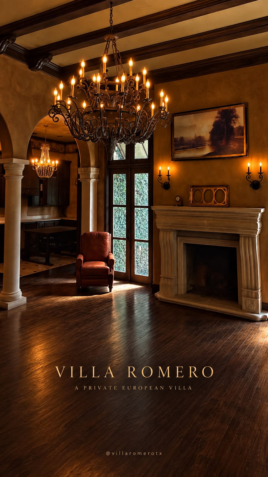 Chandelier, arches, fireplace, and piano inside Villa Romero